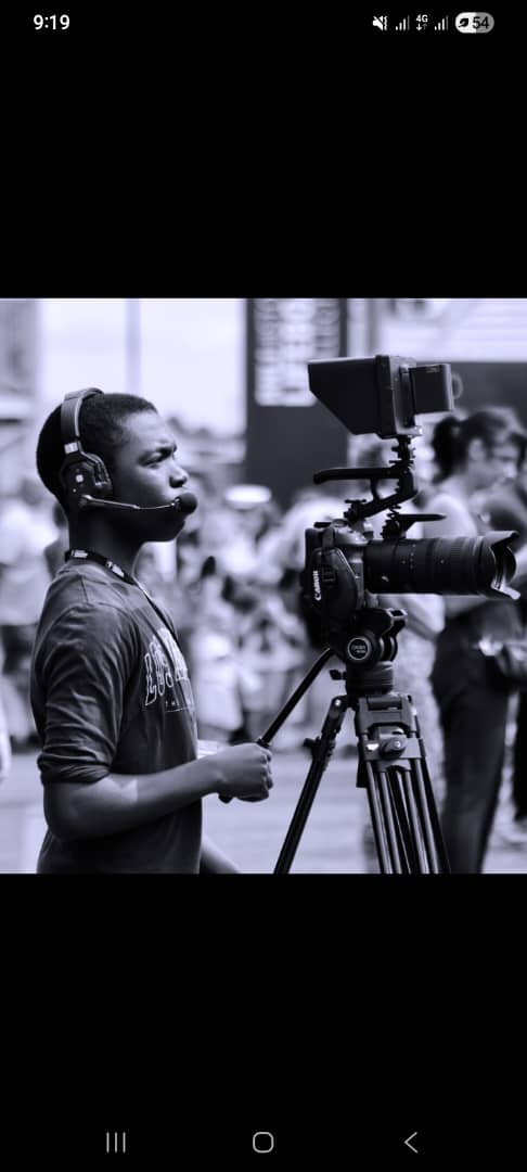 Iyanuoluwa operating a professional camera